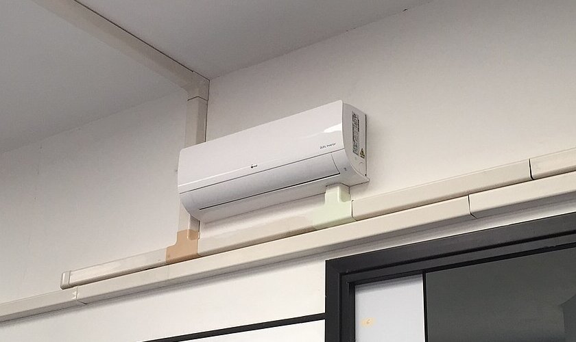 LG Dual Inverter wall-mounted air conditioning unit installed with neat trunking